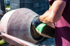 Mixing,Different,Ingredients,For,Concrete,In,A,Portable,Concrete,Mixer.